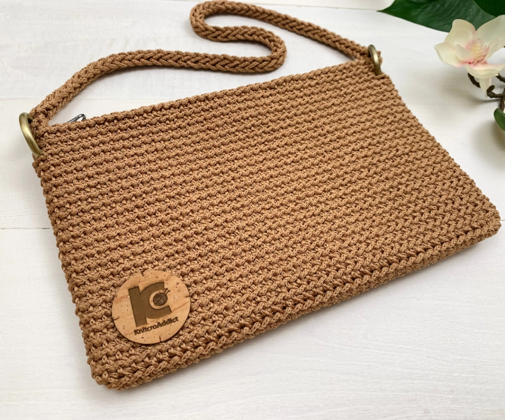 a finished crochet clutch handbag style purse